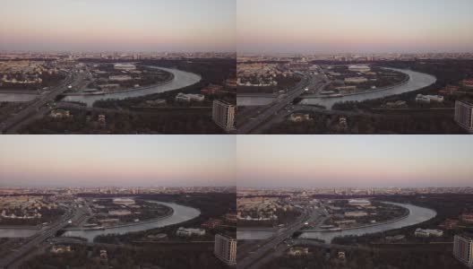 俄罗斯日落黄昏莫斯科城市景观河著名的卢日尼基体育场综合航拍全景4k高清在线视频素材下载