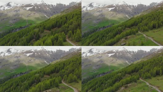 空中:飞越高山峡谷，风景如画的瀑布，雪山山脉和戏剧性的道路高清在线视频素材下载