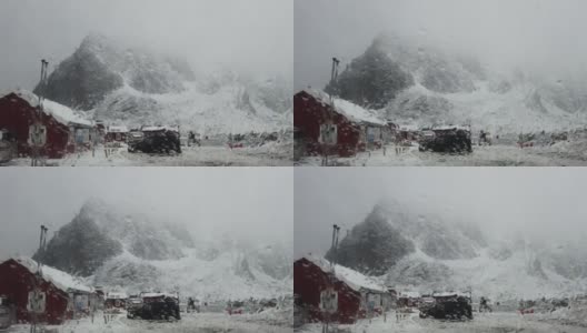 4K镜头的雨滴在车窗和背景风景的景观雪山与多云在勒内罗布尔村，冬季，罗浮敦群岛。挪威高清在线视频素材下载