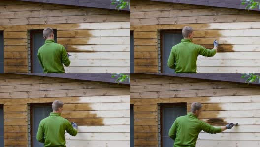 油漆工用油漆刷油漆房屋外立面用木质保护色高清在线视频素材下载