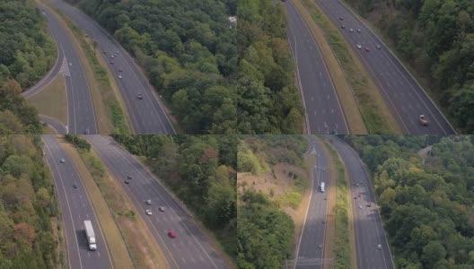 空中镜头:阳光明媚的日子里，半挂卡车和私家车在州际公路上飞驰高清在线视频素材下载