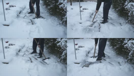 一位老人正在清理前院人行道上的积雪高清在线视频素材下载