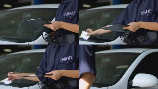 女停车管理员签罚单，贴在挡风玻璃上，规矩高清在线视频素材下载