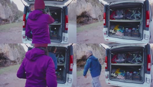 一个女人把她的背包给登山教练，让他把背包装进货车高清在线视频素材下载