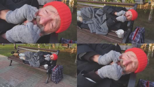 身无分文的老人躺在公园长凳上，冻得发抖高清在线视频素材下载