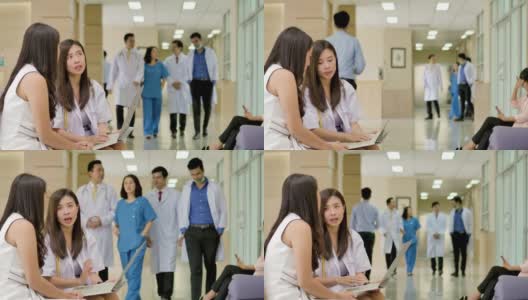 医生和病人在医院大厅一起讨论和交谈。高清在线视频素材下载