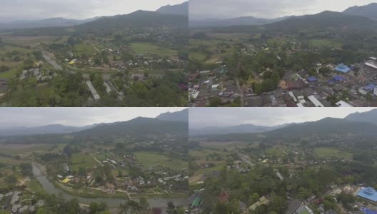 鸟瞰图:宁静的村庄靠近泰国北部的主要河流高清在线视频素材下载