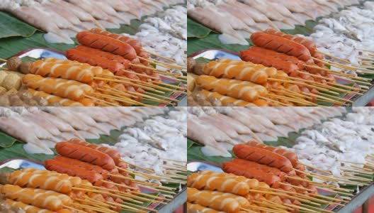 泰国的国家街头小吃。街边小卖部柜台上的香肠条和异国风味的菜肴高清在线视频素材下载