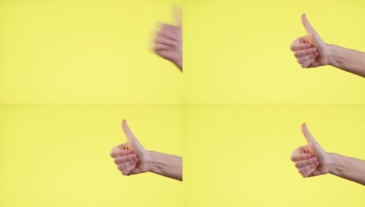 近裁男子的手显示拇指向上的手势标志孤立在黄色背景在工作室高清在线视频素材下载
