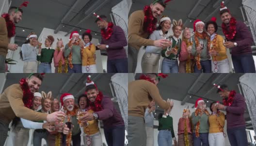 一群快乐迷人的多种族同事，在办公室兴奋地庆祝圣诞节假期高清在线视频素材下载