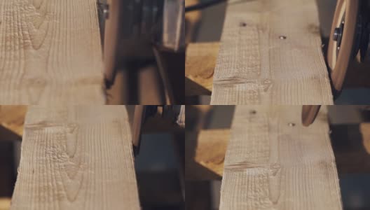 角磨机沿木板一侧滑动，产生大量木屑高清在线视频素材下载