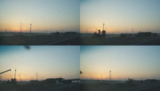 在日落时分，在高速公路上驾驶着风车高清在线视频素材下载