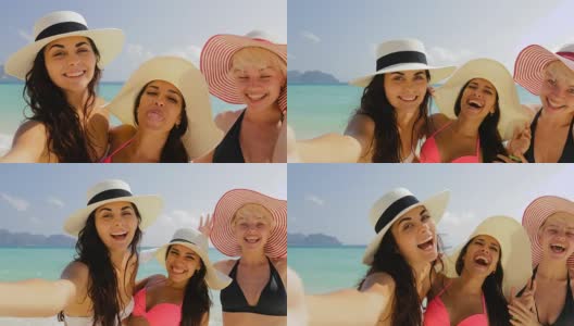 在海滩上用手机自拍的女孩，快乐的穿着比基尼和草帽的女人在暑假高清在线视频素材下载