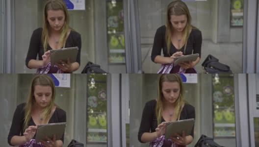 女孩刷平板电脑的特写高清在线视频素材下载