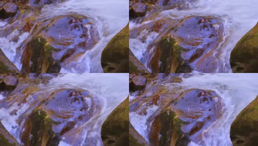 一条纯净的河流流淌在巨大的石块之间高清在线视频素材下载