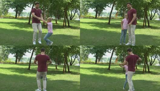爸爸和儿子在公园玩，竖起大拇指，珍惜和家人在一起的时间高清在线视频素材下载