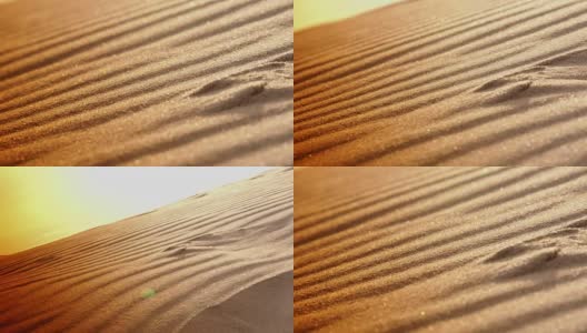 日落和从海上沙丘吹起的沙子高清在线视频素材下载