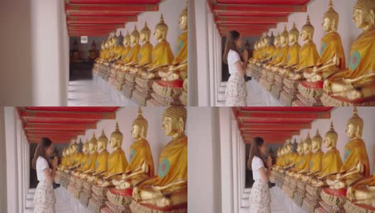 泰国女导游的日本同胞参观了该国的主要景点。“卧佛寺”是泰国曼谷的地标。高清在线视频素材下载