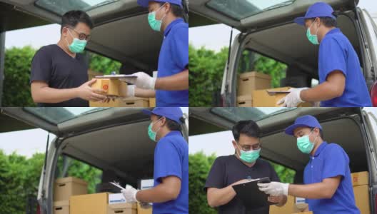 冠状病毒的概念。亚洲蓝色快递员戴着防护口罩和医用橡胶手套在发货前将包裹寄给客户。4k分辨率和慢动作拍摄。高清在线视频素材下载