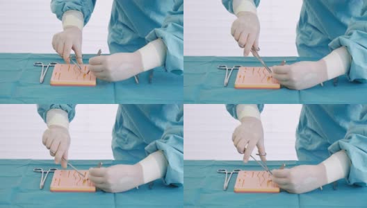 医学生使用医疗设备来练习缝合。高清在线视频素材下载