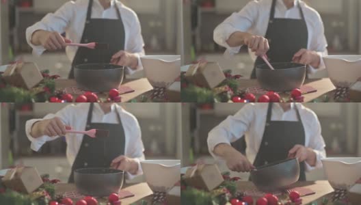 慢镜头亚洲中式甜点厨师厨师准备和搅拌巧克力配料准备脆饼圣诞庆典高清在线视频素材下载