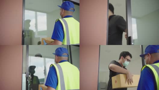蓝色快递员戴着防护口罩和医用橡胶手套将包裹硬纸板寄给客户。4 k决议。高清在线视频素材下载