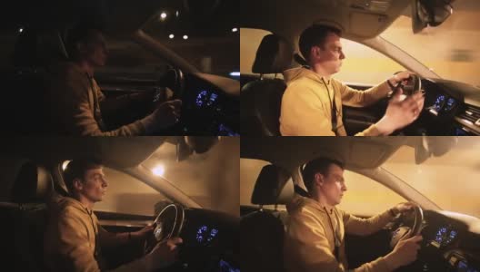 司机开车在城市的夜晚。他吃惊地做了个手势。高清在线视频素材下载