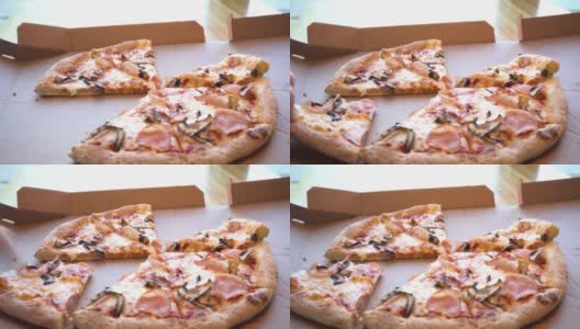 男子手拿着一片热披萨，披萨上有拉伸的奶酪，蓬松的披萨上有火腿、蘑菇和奶酪，男子手拿着一片披萨高清在线视频素材下载