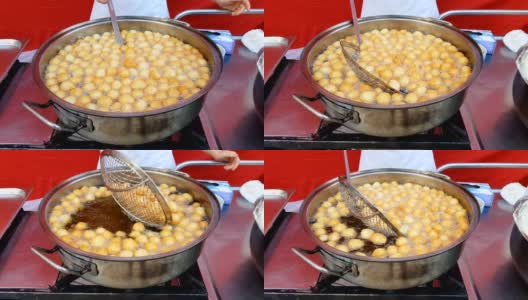 在滚烫的油里煎豆腐球高清在线视频素材下载