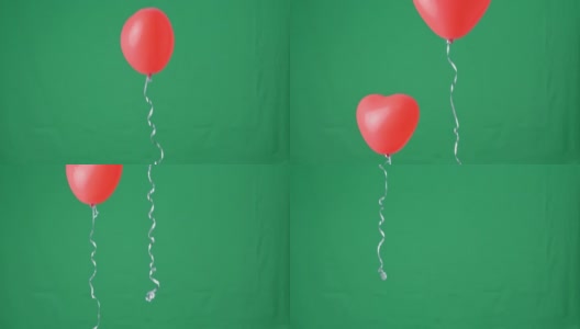 红色心形氦气球孤立在绿色屏幕背景上，情人节、生日派对的设计理念高清在线视频素材下载