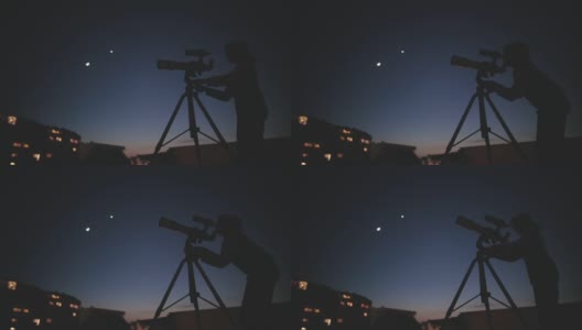 天文学家小女孩用望远镜看星星和月亮，背景是模糊的城市灯光。高清在线视频素材下载