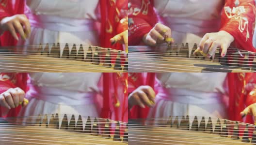 女子弹奏着中国传统乐器，优美动听的古筝高清在线视频素材下载