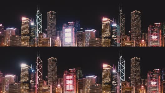 香港中环晚上的天际线-摩天大楼的霓虹灯时间流逝高清在线视频素材下载