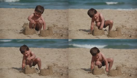 男孩正在海滩上建沙堡高清在线视频素材下载