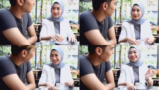 年轻的亚洲夫妇喜欢一起在咖啡馆喝咖啡高清在线视频素材下载