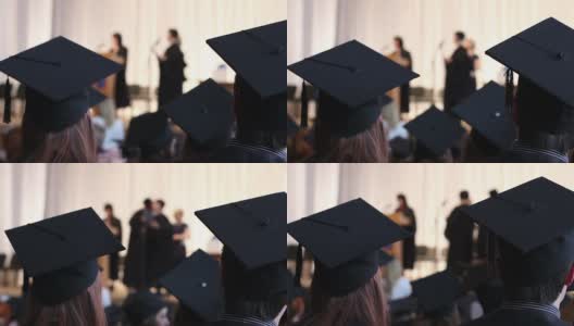 大学毕业生获得硕士学位证书。穿着长袍的年轻人高清在线视频素材下载