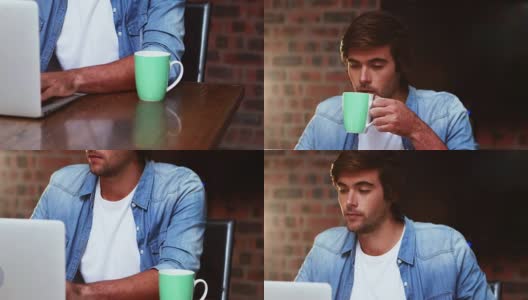 一边喝咖啡一边用笔记本电脑工作的男人高清在线视频素材下载