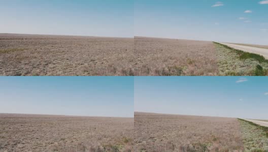 在俄罗斯卡尔梅克共和国的蓝天下，沙漠草原高清在线视频素材下载