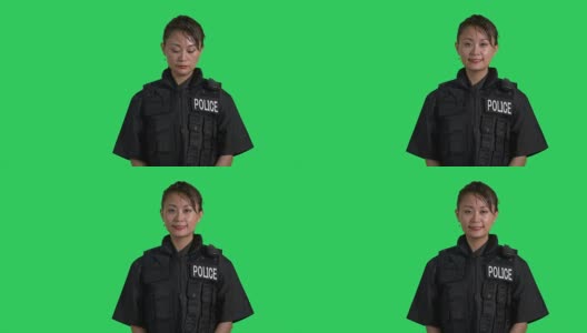 身穿防弹衣的亚洲警官对着镜头微笑高清在线视频素材下载
