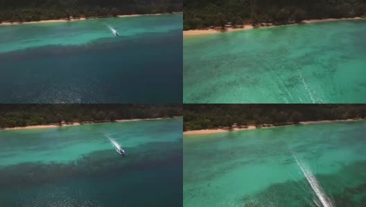 鸟瞰图的传统船在天堂般的海Koh Rok Yai岛。高清在线视频素材下载