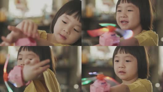 泰国快乐的小女孩在周末笑着和积极的情绪玩玩具高清在线视频素材下载