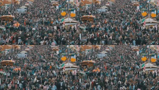 慕尼黑啤酒节中央大街上人群的顶视图。巴伐利亚,德国。慢动作高清在线视频素材下载