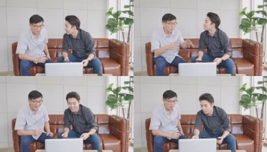 保险代理人向亚洲资深男士介绍如何在家使用笔记本电脑购买健康保险高清在线视频素材下载