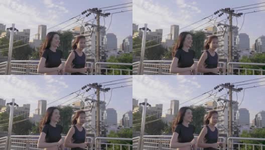 亚洲女性朋友在城里慢跑高清在线视频素材下载