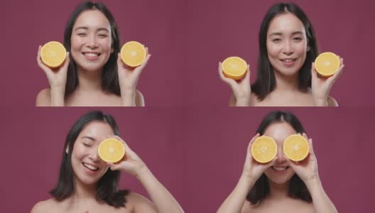 年轻的亚洲女人摆着柠檬半眼睛对着玛萨拉copyspace高清在线视频素材下载