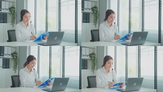 亚洲美女与人力资源经理视频电话面试。漂亮的女孩用笔记本电脑进行虚拟的在线会议，讨论和展示简历给上班族找工作。高清在线视频素材下载