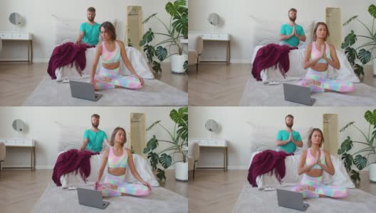 一对夫妇在网上做瑜伽。一位女士选择了一个冥想教程，她和她的丈夫一起冥想高清在线视频素材下载