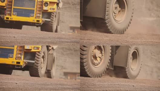 一辆自卸车沿着公路行驶，黄色的自卸卡车在采石场外，工业外观高清在线视频素材下载