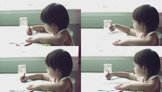 小女儿正在用彩色铅笔画画高清在线视频素材下载