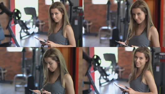 在健身房用平板电脑浏览的女人高清在线视频素材下载